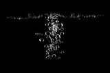 High-contrast macro shot of rising water bubbles against a deep black background, emphasizing clarity, purity, freshness, hydration, and dynamic liquid motion for modern clean visual concepts.