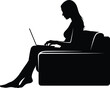 © Muhammad - Silhouette of a woman using a laptop while relaxing on a chair