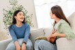 © Hip.hub - Two friends enjoy a music session together in a cozy living room during the afternoon