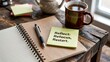 © Stocker - Motivational note on wooden desk with coffee and notebook ready for reflection and planning, encouraging self-improvement and new beginnings for personal growth