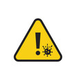 © Bunda - A prominent yellow triangular warning sign alerts individuals to potential viral hazards, emphasizing the critical need for health precautions and awareness during a pandemic.