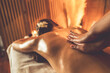 © InfiniteFlow - Caucasian woman customer enjoying relaxing anti-stress spa massage and pampering with beauty skin recreation leisure in warm candle lighting ambient salon spa at luxury resort or hotel. Quiescent