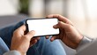 © The Little Hut - Man Holding Smartphone with Blank Screen Mockup for App or Content Presentation
