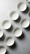 © Tukijo - Arrangement of empty bowls on a textured surface for abstract backgrounds