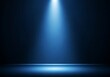 © Tech - A bright blue spotlight illuminates a dark stage background for a dramatic effect