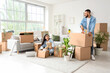 © Pixel-Shot - Young couple packing things in rented apartment on moving day