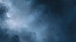 © buraratn - Dark and Mysterious Atmospheric Sky Background with Dramatic Cloud Formations in Shades of Deep Blue and Gray for Creative Projects and Design Purposes