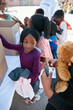© Leffy2000/peopleimages.com - Children, line and boxes with charity for donation, poverty outreach or volunteering in rural area. Group, NGO or packages with kids or handout for community service or humanitarian aid at orphanage