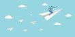 © SreemotiRaba - A businessman flies through the sky on a paper airplane achieving his goals