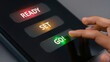 © The Stock Hub - Ready Set Go: Hand Pressing Green GO Button on Digital Screen | Start, Launch, & Action Concept