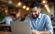 © Sophia - Arab young businessman working with laptop in cafe. High quality