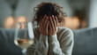 © Alexey - Woman covering face with hands in despair after drinking alcohol, concept of hangover, addiction, sadness. Emotional upset.