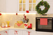 © New Africa - Stylish kitchen with Christmas decor. Interior design