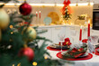 © New Africa - Festive table setting with Christmas decor in kitchen, closeup. Interior design