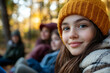 © Tetiana - Girl enjoying autumn camping trip in forest, wearing warm jacket and smiling outdoors, generative ai