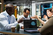 © DC Studio - Startup coworkers discussing machine learning tech roadmap during briefing session. Computer scientists developing AI applications in office, analyzing system performance metrics after QA testing