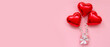 © Pixel-Shot - Composition with gift box and heart shaped balloons on pink background. Valentine's Day celebration