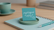 © anees - Blue sticky note on a notebook reads psychological safety with small heart drawings. Beside is a teal pen and coffee cup. Concept for workplace wellbeing mental health. Workplace Well-being & Organiza