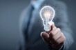 © Ifti Digital - Consultant presents innovation idea with glowing light bulb concept in a modern business setting