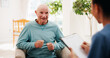 © peopleimages.com - Clipboard, conversation and healthcare with old man speaking to nurse in home living room. Medical, notes or report with caregiver and senior patient in apartment for consulting, feedback or review