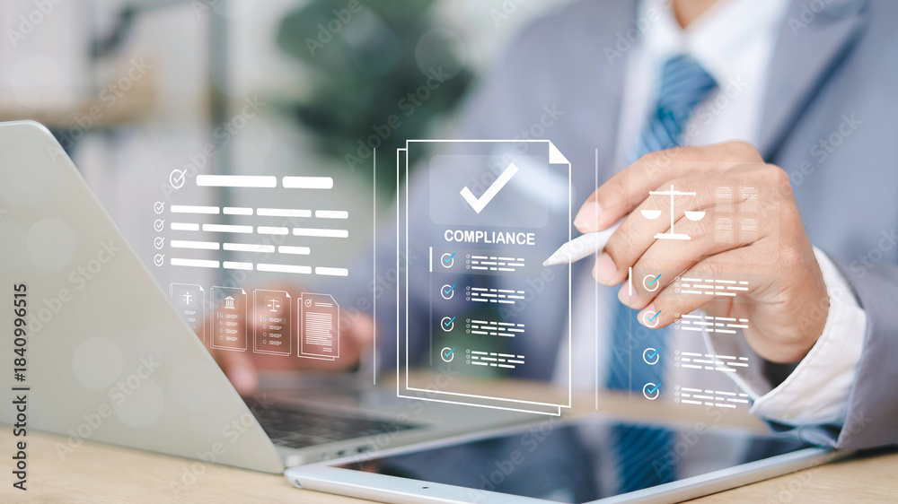 Business person stamping documents with a digital compliance interface ...