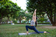 © leungchopan - Woman practice yoga outside in natural light