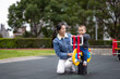 © leungchopan - Happy baby having fun on rocking chair playground