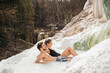 © Studio Marmellata - couple relaxing in natural hot springs
