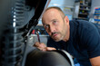 © auremar - motorbike mechanic checking on the spring