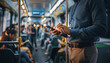 © SolaruS - Modern commuter uses a smartphone on a busy public transportation vehicle, highlighting urban connectivity, digital productivity, and daily efficiency.