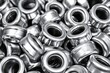 © ywdh - pile of shiny stainless steel cylinder nuts stacked in industrial setting for machinery assembly and equipment maintenance