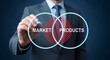 © Pixel Studio - Businessman draws a glowing venn diagram illustrating the intersection between market needs and product development strategy for business success