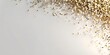 © FANGWORLD - Golden glitter scattered across a clean, bright white surface, creating a festive and luxurious abstract background with soft shadows