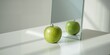 © Holo Frame - Whole green apple reflected in mirror on table surface, suitable for culinary layout background