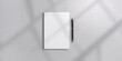 © vxnaghiyev - Note papers and pen on a gray background used for writing or note-taking, workspace organization