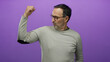 © Krakenimages.com - Hispanic elderly man flexing arm on isolated purple background wearing glasses showcasing strength and confidence.