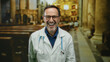 © Krakenimages.com - Doctor in a church setting smiling with stethoscope, wearing glasses, covering eye, hispanic man, blending medical and spiritual symbolism in a unique indoor environment.