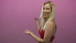 © Krakenimages.com - Woman in red lace bra showing bare shoulder and presenting with palms up in pink studio; confidence empowerment.