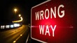 © Valentina Sorokina - Red wrong way traffic sign illuminated at night on highway