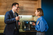 © Miljan Živković - Business colleagues laughing enjoying coffee break in office