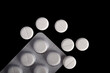 © Mulad Images - Antibiotic pills, medicinal tablets, capsules in blister packs on black background. Concept of pharmacy, medicine, vitamins, food supplements.
