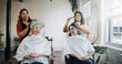© MagicDavid25/peopleimages.com - Beauty, hairstylist and talking with friends in salon for cosmetology, gossip and grooming. Hairdresser, parlor and customer makeover with people in store for hair care, relax and conversation