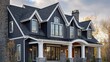 © AR - A beautiful custom house exterior featuring dark blue board and batten siding and stone accents