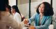 © SnapK/peopleimages.com - Handshake, smile and meeting with business woman in office for welcome, thank you and teamwork. Shaking hands, partnership and introduction with employees in agency for workshop and collaboration