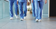 © SnapK/peopleimages.com - Legs, people and nurses walking in hospital for staff duty, shift change and medical services. Group, employees and team in lobby for patient care, healthcare treatment and ward round for procedure