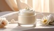 © ke - Close-up of a glass jar of creamy white skincare product