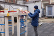 © Rychko Yevhen - Caring father assisting his child on a playground monkey bars in winter season