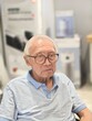 © Creativa Images - Close-Up Portrait of a Distinguished Elderly Asian Man with Eyeglasses