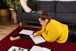 © LIGHTFIELD STUDIOS - Finding inspiration while relaxing at home plus size woman writes in cozy attire