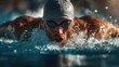 © Azadart - Swimmer performs a competitive stroke in a pool while focused on achieving a fast time and improving technique during training sessions